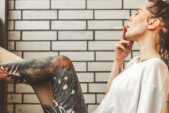 Girl house balcony with her doll during lockdown period due to covid-19 epidemic.