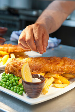 fish and chips prepared at commercial kitchen in the UK