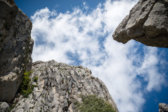Low angle shot of the sky with clouds and limestone mountains in Andalusia.