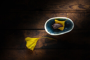 Pine cone in a tiny bowl