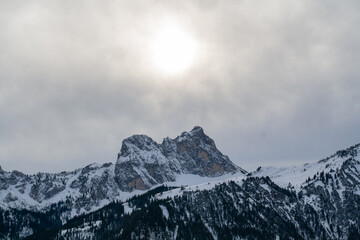 Fototapeta na wymiar Fuessen, Germany - January 14th 2023 - The famous Aggenstein mountain in winter under the shining sun