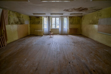 An old school in an abandoned manor house in central Poland, Europe in autumn