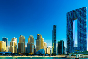Obraz na płótnie Canvas Dubai jumeirah beach with marina skyscrapers in UAE. Popular public JBR beach