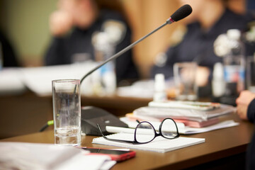 women's glasses with diopters lie on a notebook on the table. Iron-framed glasses, pen, notebook...
