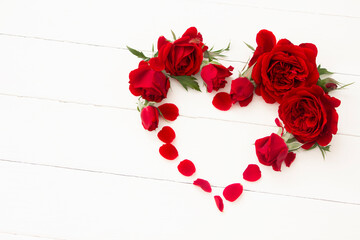Red roses heart,  Valentine's Heart on white wooden board. Valentine's day, love, wedding background. Red Heart template