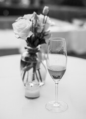 Centerpiece made with  flowers and a cup of champagne