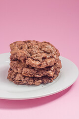 chocolate cookies on the pink background
