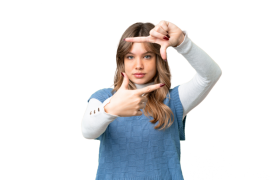 Young girl over isolated chroma key background focusing face. Framing symbol