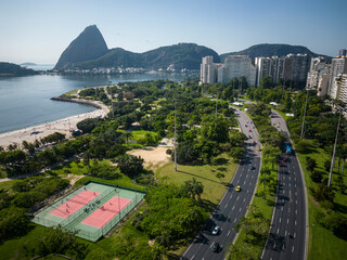 Beautiful aerial view to green areas, city buildings and mountains