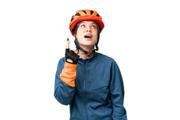 Young cyclist girl over isolated chroma key background pointing up and surprised