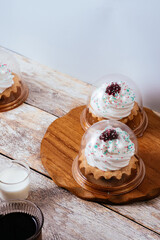homemade cupcake with a cap of buttercream and jam