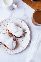 homemade eclairs with white vanilla glaze