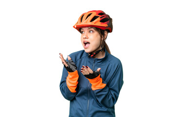 Young cyclist girl over isolated chroma key background with surprise facial expression