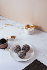 homemade round chocolate candy with coconut sprinkles