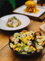 Gourmet shrimp salad and different green sprouts