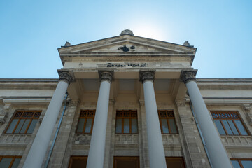 Fototapeta premium Entrance of Istanbul Archaeological Museums, a museum in Istanbul, giant historical gate, access hatch, exterior idea, open blue sky with sunlight