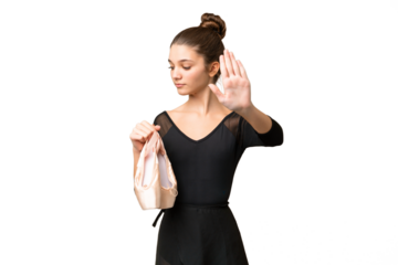 Teenager girl practicing ballet over isolated chroma key background making stop gesture and disappointed