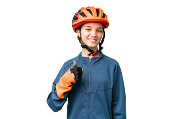 Teenager cyclist girl over isolated chroma key background giving a thumbs up gesture