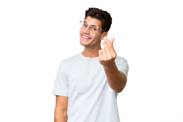 Young caucasian handsome man over isolated background making money gesture