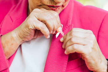 woman dressed in pink. breast cancer awareness day.