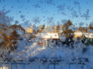 Snowflake Build-up from a Window in Winter.
Snowflakes were building up from the outdoor surface of a window during a sunny but cold winter weather in Finland.