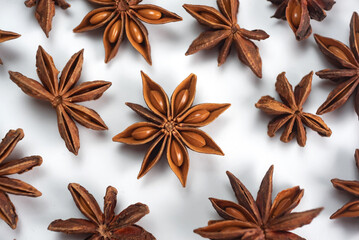 A lot of star anise on a white background close-up