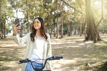 Asia woman selfie her self on bicycle.