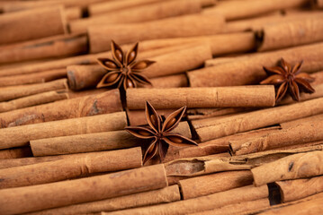 Star anise lies on a large number of cinnamon rolls