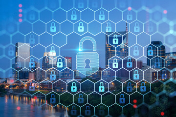 Panoramic view of Broadway district of Nashville over Cumberland River at illuminated night skyline, Tennessee, USA. Padlock hologram. The concept of cyber security to protect confidential information