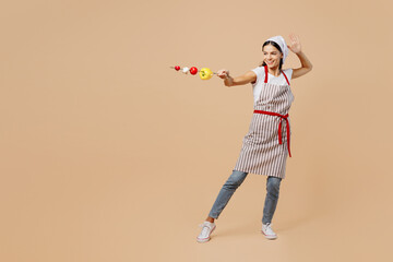 Full body young housewife housekeeper chef baker latin woman wear striped apron toque hat making...