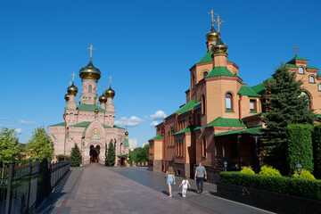 Fototapeta na wymiar People in Holy Intercession Monastery, Goloseevsky Hermitage, Kyiv, Ukraine