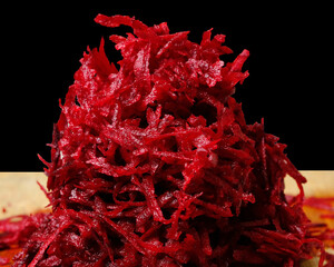 Beetroot sliced close-up, on a black background macro