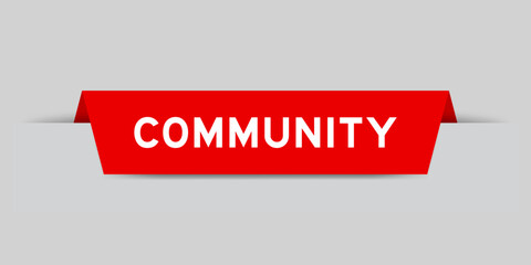 Red color inserted label with word community on gray background