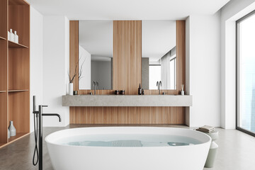 Light bathroom interior with tub and two washbasins, panoramic window
