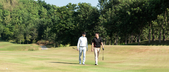 Group golf professional Golfer asian man walking in fairway with bag golf at golf  club.  Hobby in...