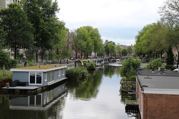 Fototapeta na wymiar Landscape with canal in Amsterdam, Netherlands