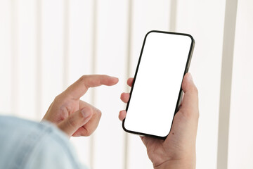 Close up of Man holding mobile phone with white background.