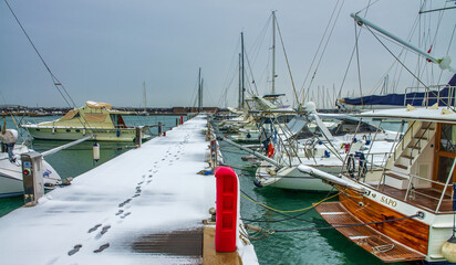 Pisa, Italy - March 1st, 2018: Snowfall the port of Marina di Pisa