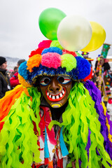 Gody Zywieckie - traditional winter parade of 'Dziady', folk custom in Zywiec region, man dressed in traditional colorful costume of Macidula (shredder), Milowka, Poland