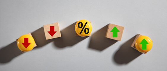 Percentage symbol with up and down arrows. Interest rates