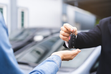 Business car rental, sell or buy service, dealership hand of agent dealer, sale man giving auto key...