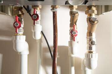 Gas heating system with red taps.