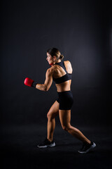 Woman do high kick, tae-bo. Athletic fit female with perfect body kick air, punching with legs