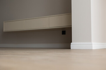 Plinth on laminate. the floor of a new apartment