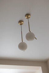 a white round light bulb in a modern interior of a house room