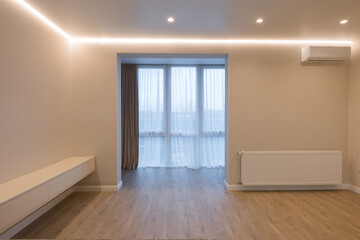 Fototapeta na wymiar Modern kitchen in the interior of a new apartment in beige tones