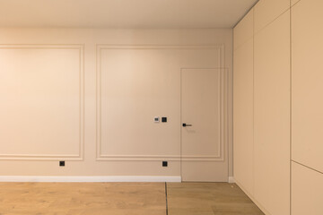 Designer wall in a modern interior. White room.