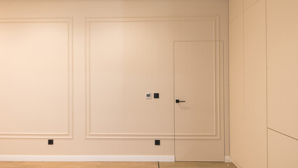 Designer wall in a modern interior. White room.