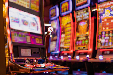 Obraz na płótnie Canvas close up background of slot machine in casino club entertainment leisure concept
