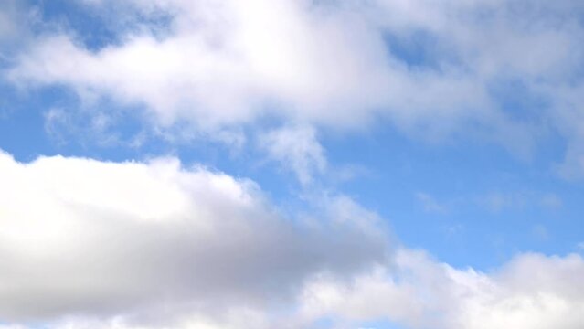 Close-up of passing clouds on blue sky during windy day, nature landscape, video 4k resolution